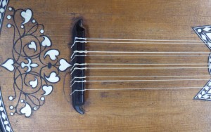 Baroque guitar with new gut strings, detail of bridge. Check out that inlay!