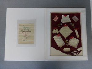 Needlework sample in bespoke folder, after conservation
