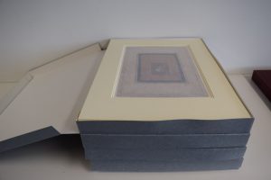 Mounted artworks stored within new boxes