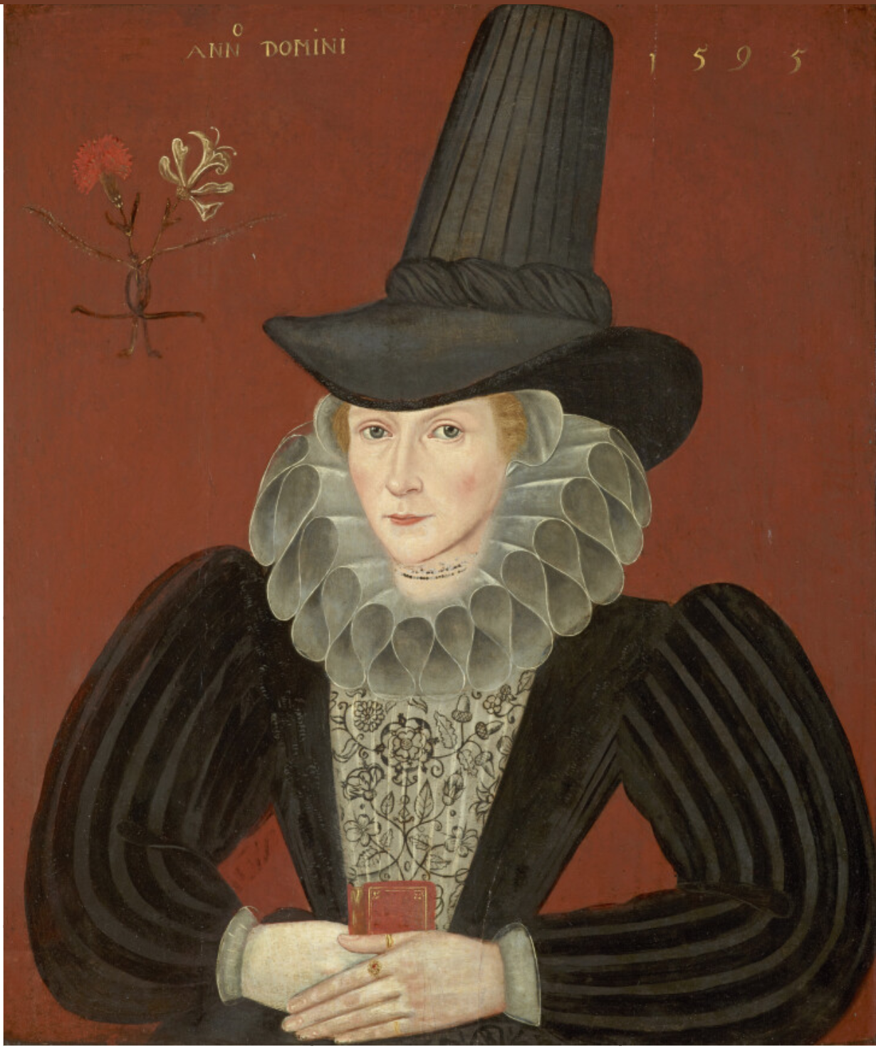 A painted portrait of Esther Inglis, by an unknown artist, painted in 1595. Image shows a woman in three-quarters profile, wearing a black dress with an embroidered panel, a ruff around her neck, and a tall black hat. Her hands are folded over a small red book. The background of the painting is a dark red, with a design of intertwined carnation and honeysuckle stems. The words ANNO DOMINI 1595 are written in gold at the top of the painting.