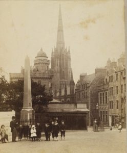 Albumen print showing Patrick Geddes and a group of children in front of the Outlook Tower (Patrick Geddes Collection, Ref: Coll-1167/B/23/12​)