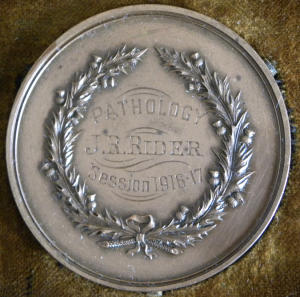 Reverse, bronze medal, decorated with thistle wreath surrounding the inscriptions - Pathology. J.R.Rider, Session 1916-17