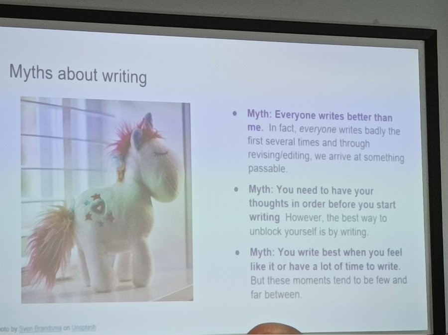 Slide from Getting Your Writing Groove Back presentation. Slide is entitled 'Myths about writing' with a picture of a stuffed unicorn on the left. Full slide content is available via the LILAC Conference website.
