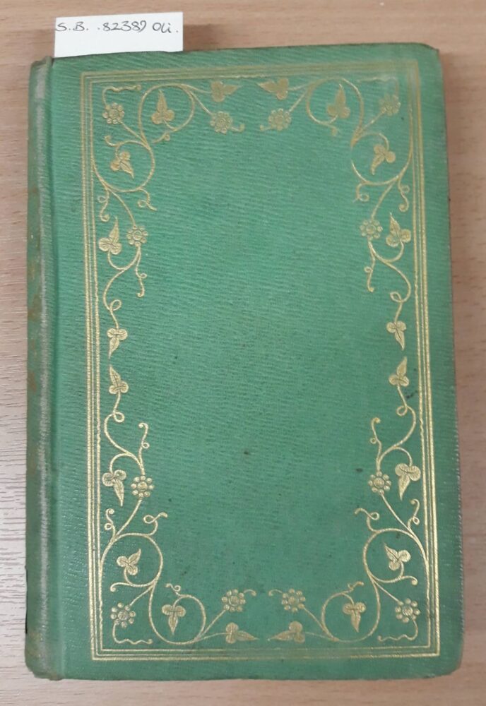 A bright green hardcover book. The cover is decorated with a border of golden vines