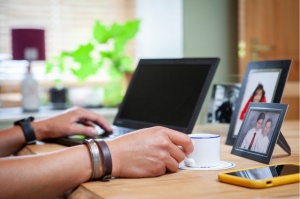 Hands on laptop with coffee