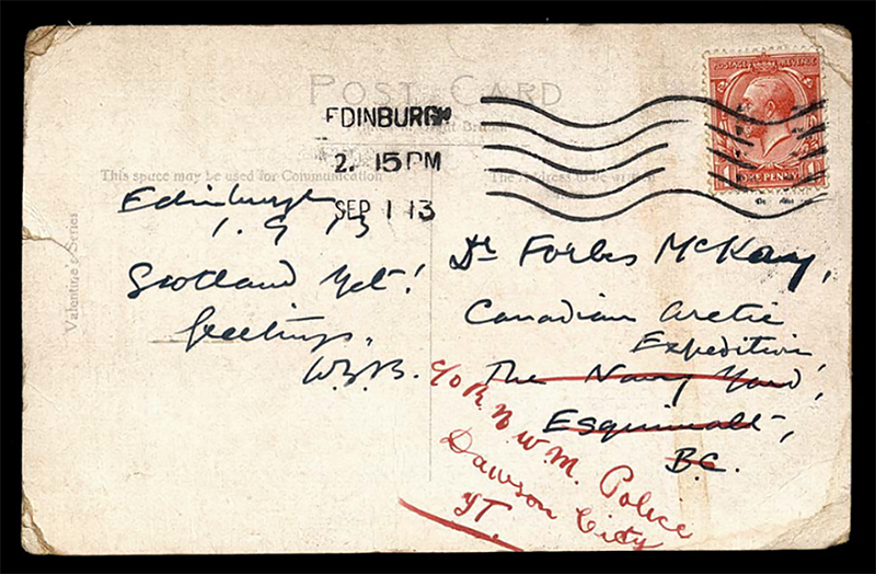 Reverse side of a postcard. The paper is yellowed and there is a postmark over the red stamp.