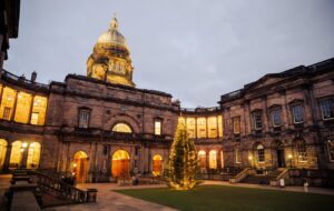 Lit christmas tree in the Old college quad in Edinburgh